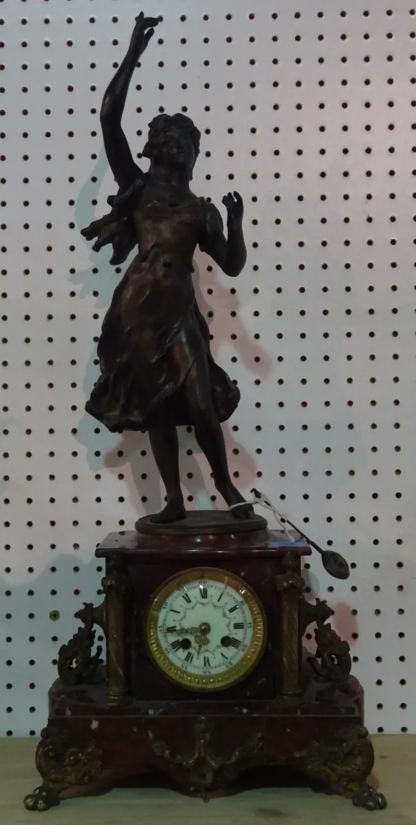 A 19th century large marble 8 day mantel clock with gilt metal decoration and figural spelter finial formed as a lady.   ROST