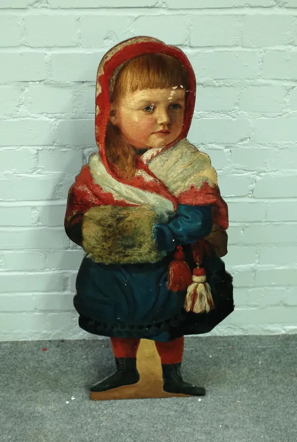 A painted dummy board, of a young girl, dressed for winter, 39cm wide x 98cm high.