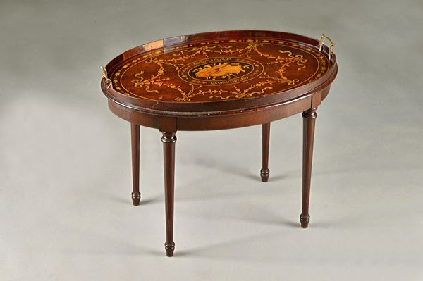 An Edwardian marquetry inlaid galleried oval serving tray, on later stand, 68cm wide x 50cm high. Illustrated.