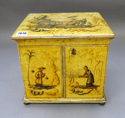 A Regency cream lacquered chinoiserie decorated table top cabinet, with pair of doors enclosing drawers, 30cm wide x 28cm high.