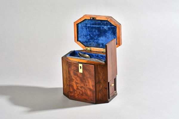 A George III mahogany walnut and specimen wood tea caddy, of compressed octagonal form, the side panel revealing two tea drawers, 16cm wide x 14cm hig