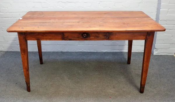 An early 19th century French plank top fruitwood kitchen table, on tapering square supports, 81cm wide x 151cm long.