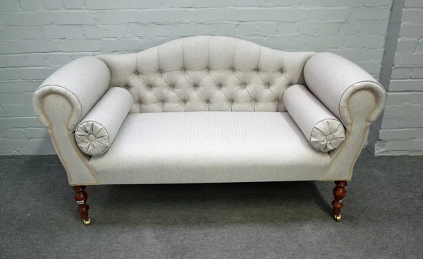 A Regency style small hump back sofa, on turned supports, 21st century, 140cm wide x 77cm high.