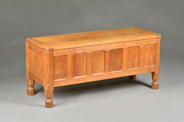 Robert 'Mouseman' Thompson, an adze oak coffer, with six panel front, on octagonal feet, 105cm wide x 47cm high. Illustrated.