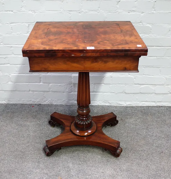 A William IV mahogany games table with fold out top on reeded column, 55cm wide x 73cm high.