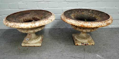 A pair of early 20th century white painted cast iron jardinieres, with shallow lobed bodies, 48cm diameter x 38cm high, (2).