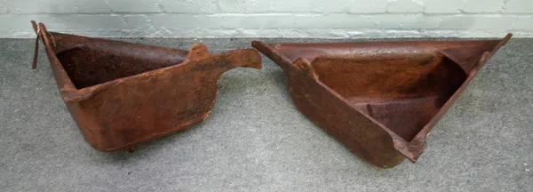 A pair of 20th century cast iron corner drinking troughs, with harness loops, 73cm wide x 44cm deep.