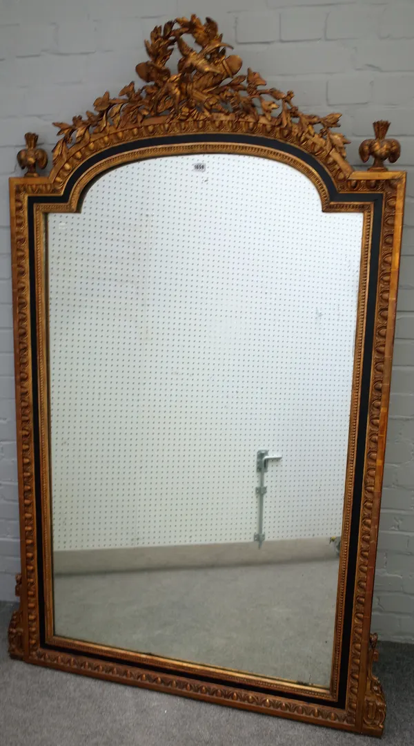 A Victorian gilt framed overmantel mirror with songbird, quiver and bow crest over egg and dart moulded frame, 108cm wide x 190cm high.
