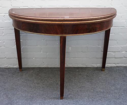 A 19th century Baltic State brass bound mahogany semi-elliptic card table on tapering square supports, 109cm wide x 75cm high x 54cm deep.