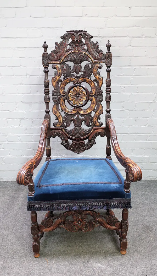 A 17th century style parcel gilt carved walnut open armchair in the Marot style, 71cm wide x 144cm high.
