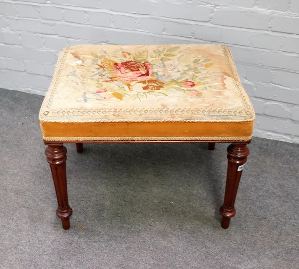 A late Victorian walnut framed rectangular footstool, on fluted supports, 63cm wide x 49cm high.