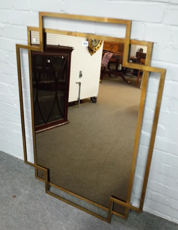 An Art Deco style lacquered brass mirror, 86cm wide x 116cm high.