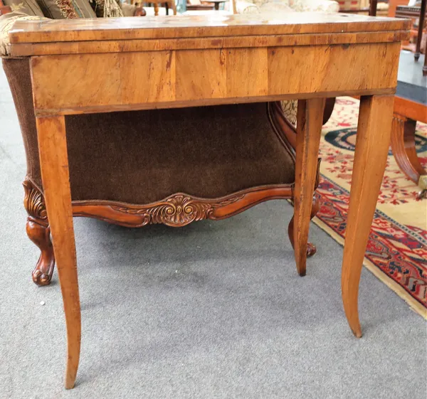 A mid-18th century figured walnut rectangular tea table on splayed supports, 79cm wide x 77cm high.