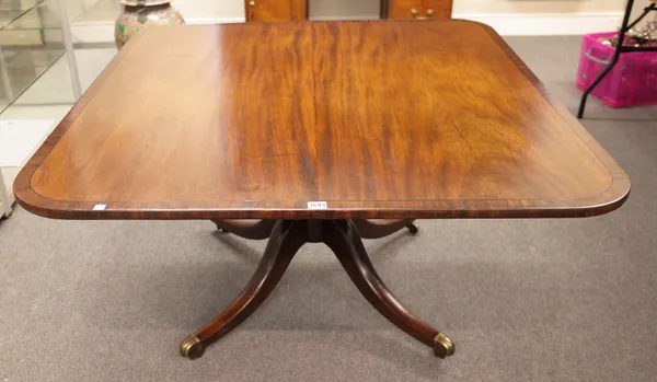 A George III mahogany breakfast table, the rectangular snap top on turned column on four downswept supports, 112cm wide x 125cm long x 72cm high.