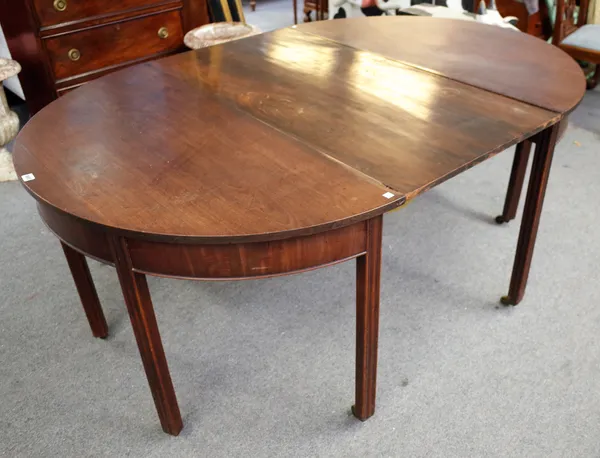 A George III mahogany 'D' end extending dining table on square supports, one extra leaf, 121cm wide x 118cm long x 178cm fully extended.
