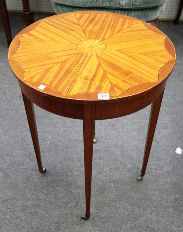 An Edwardian satinwood occasional table, the stellar veneered circular top on four tapering square supports, 55cm diameter x 72cm high.