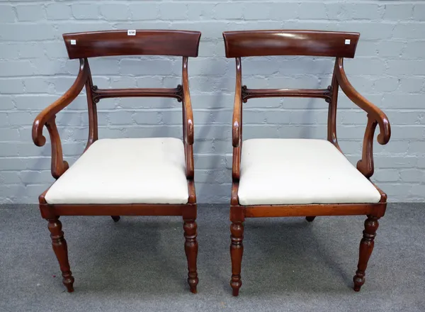 A pair of early Victorian mahogany carver chairs, on baluster turned supports, 53cm wide x 89cm high.