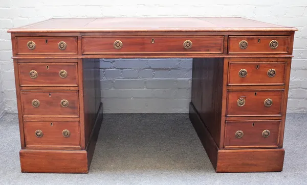 A late Victorian mahogany pedestal desk with eight drawers about the knee, on plinth base, 135cm wide x 85cm deep x 76cm high.