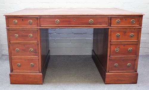 A late Victorian mahogany pedestal desk with eight drawers about the knee, on plinth base, 135cm wide x 85cm deep x 76cm high.