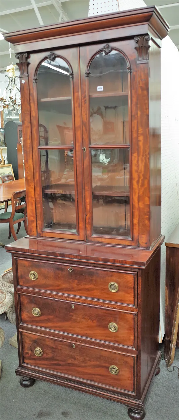 A Victorian mahogany secretaire bookcase, with pair of glazed doors, over fitted drawer and two further long drawers, 91cm wide x 219cm high.