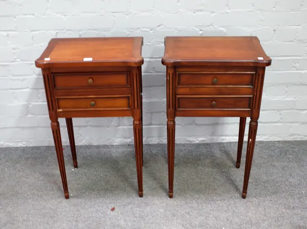 A pair of Louis XVI style walnut two drawer bedside tables, on fluted supports, 42cm wide x 69cm high.