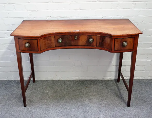 A George III mahogany concave fronted three drawer side table, on tapering square supports, 115cm wide x 80cm high.
