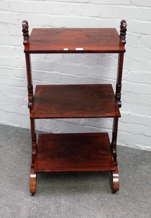 A William IV rosewood three tier what-not on lappet carved supports, 50cm wide x 98cm high x 36cm deep.