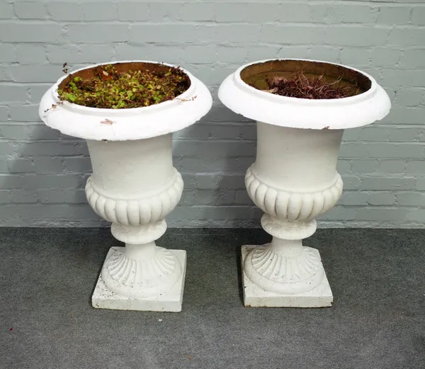 A pair of large white painted terracotta garden urns, with semi-fluted bodies, 55cm diameter x 81cm high.