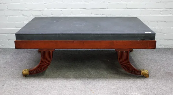 A Regency style coffee table with inset marble top on four sabre supports 122cm wide x 44cm high.
