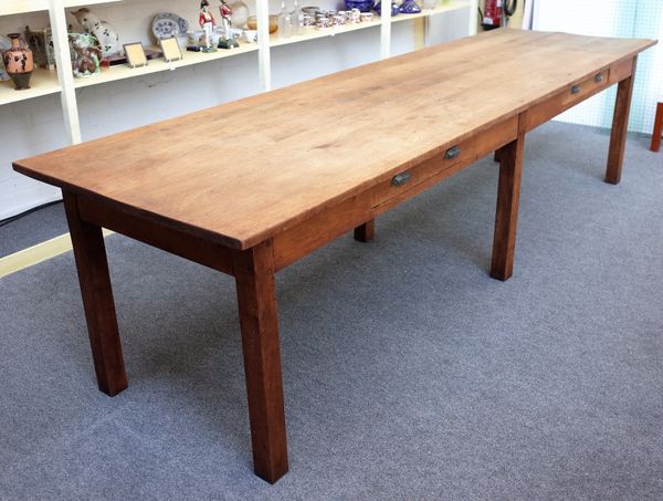 An oak rectangular kitchen preparation table, the plank top over two frieze drawers on six square supports, 87cm wide x 310cm long x 78cm high.