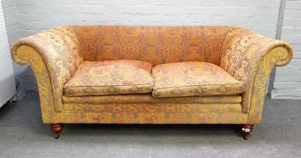 Mulberry; a Chesterfield style sofa, with heraldic upholstery on turned supports, 190cm wide x 77cm high.