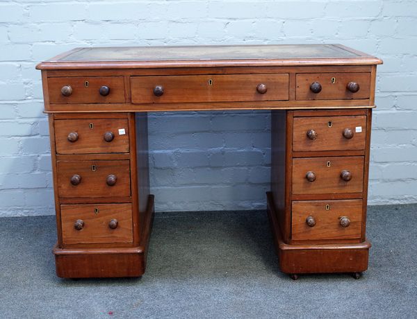 A Victorian walnut pedestal desk, with nine drawers about the knee, 105cm wide x 52cm deep.