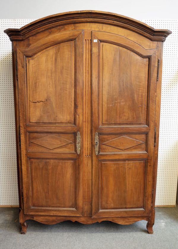 A late 18th century French chestnut two door armoire on scroll feet, 165cm wide x 235cm high.