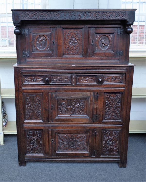 A late 17th century carved oak Didarn/court cupboard, with pair of cupboards over drawer and two further cupboards, 134cm wide x 185cm high.