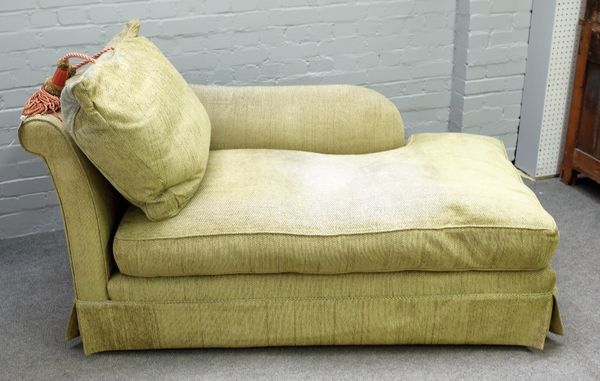 A 20th century green upholstered day bed with rollover end, 155cm wide x 80cm deep.