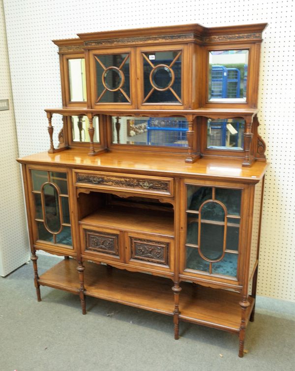 A late Victorian coromandel and walnut side cabinet with an arrangement of cupboards on turned supports, 149cm wide x 180cm high.