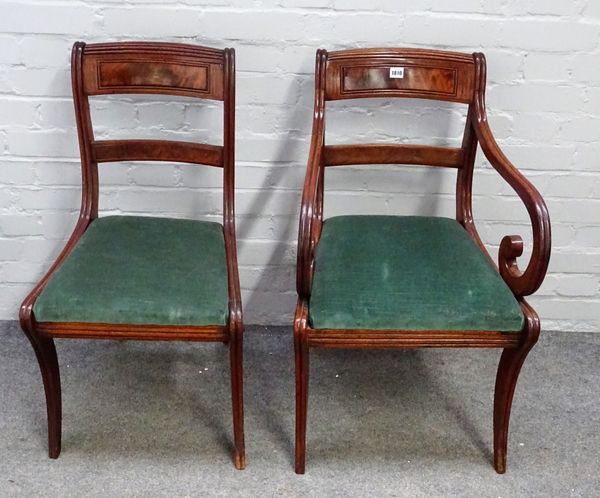 A set of seven Regency brass inlaid mahogany dining chairs, on sabre supports, to include a pair of carvers, (7).