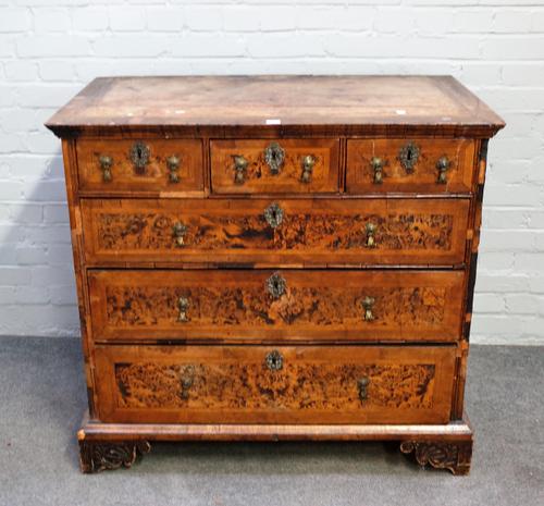 A George I walnut banded burr elm chest of three short over three long graduated drawers on later bracket feet, 103cm wide x 95cm high.