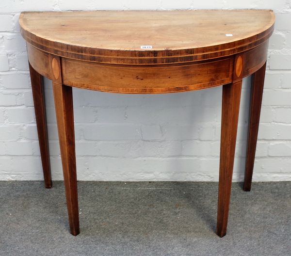 A George III mahogany demi-lune card table with tapering square supports, 91cm wide x 75cm high.