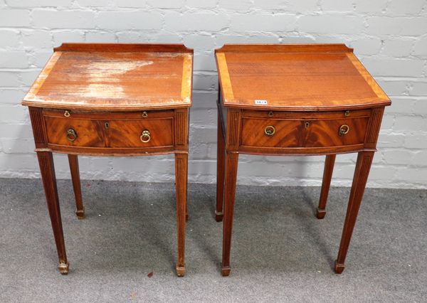 A pair of mahogany bowfront tables, each with brushing slide over single drawer, 45cm wide x 69cm high, (2).