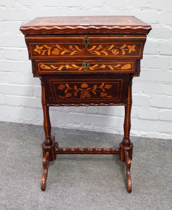 An early 19th century Dutch floral marquetry inlaid work table on turned trestle supports, 45cm wide x 72cm high.