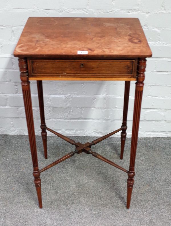 An early 19th century mahogany single drawer work table on tapering fluted supports, 46cm wide x 77cm high.