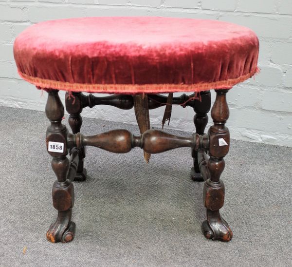 A 17th century style walnut framed oval footstool circa 1880, on block and turned supports, 54cm wide x 45cm high.