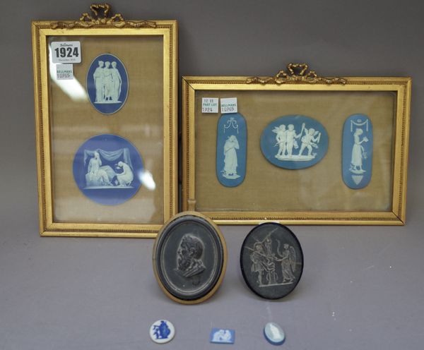 Five Wedgwood jasperware  plaques, each depicting classical or mythological figures housed in two glazed giltwood frames; two basalt oval plaques and