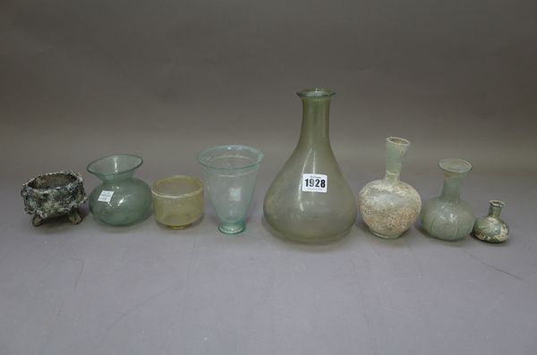 A collection of Roman and later glass bottles, ewers, bangles and similar, the tallest 19cm, (a.f) (20).