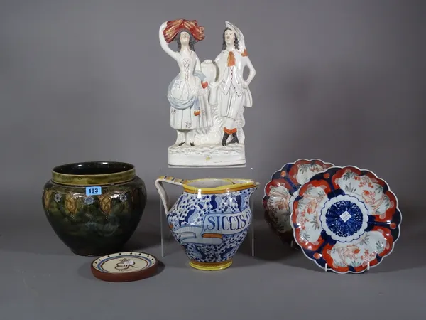 Ceramics, including; a Royal Doulton ovoid vase, two Imari plates, a pottery jug, a Staffordshire figure and a pottery coronation dish, (6).   S3M