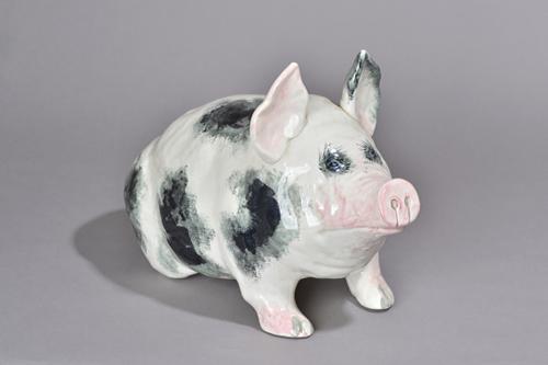 A large Wemyss pottery pig, early 20th century, modelled seated on its haunches, painted with black sponged, details picked out in pink, painted Wemys