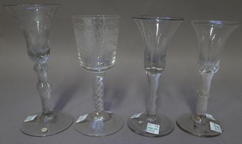 An airtwist wine glass, mid 18th century, with bell bowl, raised on a multi-series airtwist stem with vermiform collar, (a.f), 15.75cm. high; another