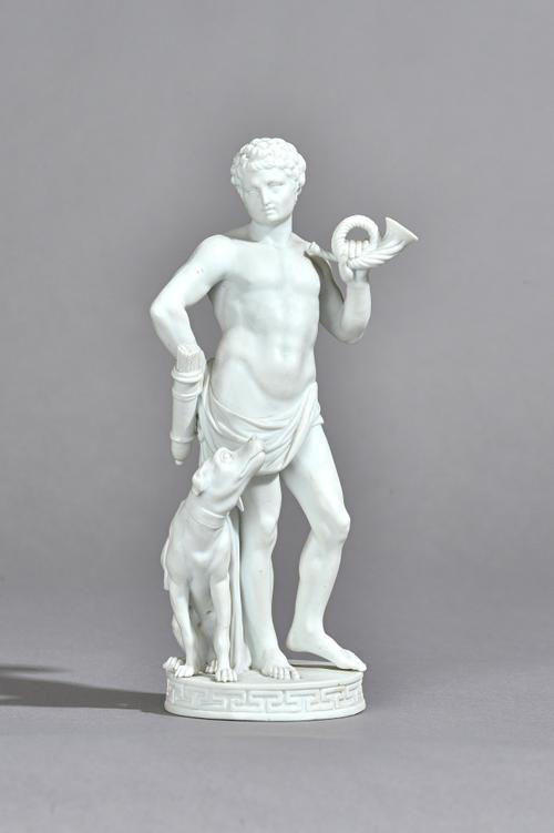 A late 18th century Meissen biscuit porcelain figure modelled as a Romanesque huntsman with hound at his side over a circular base, incised marks, 19.
