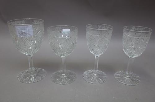 A cut glass part service, late 19th century, possibly Baccarat, each glass with etched vine rim, the tallest 13.5cm high, (34).